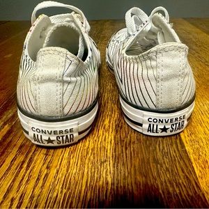 Converse All Star Size 7. White with multicolored stars. Worn a few times.